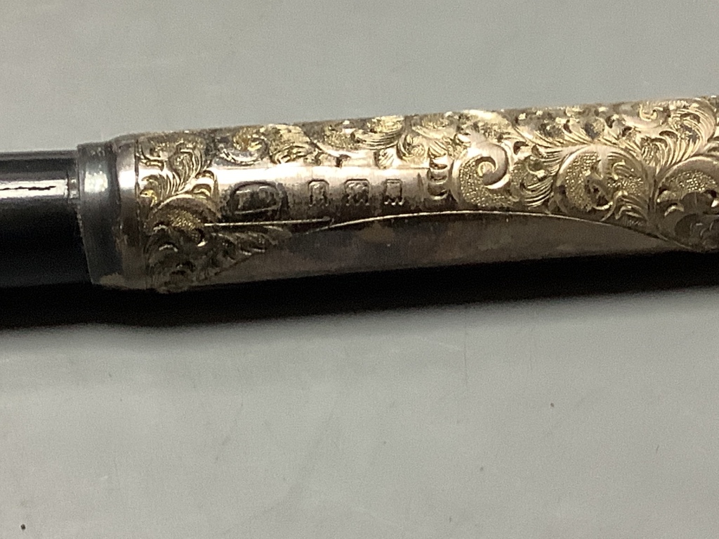 A George V silver mounted ebonised conductors baton in case, 45.3 cm.